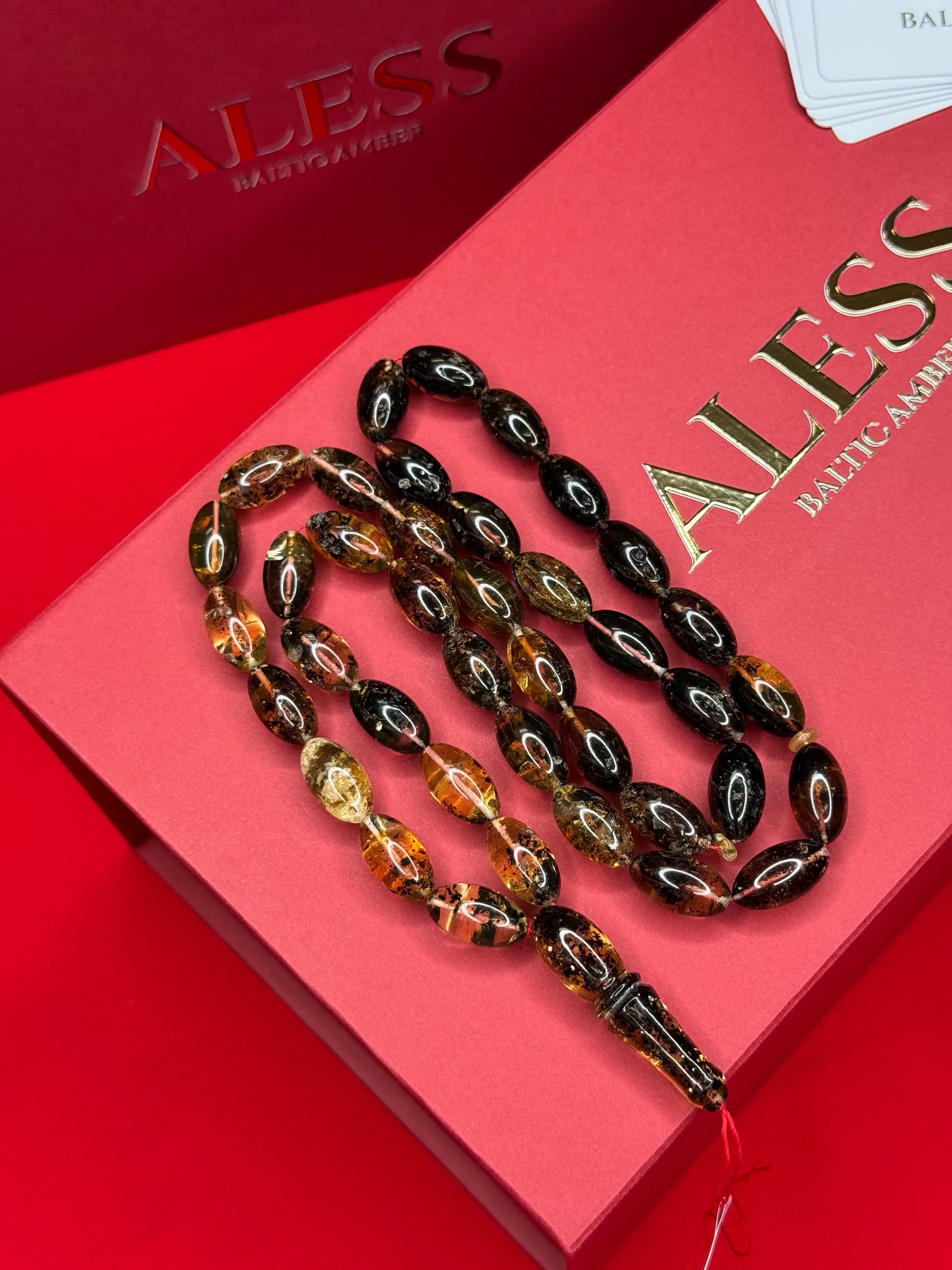 مسبحة كهرمان أسود زيتونية 39 خرزة، 19/10 مم، 50 غرام - 1